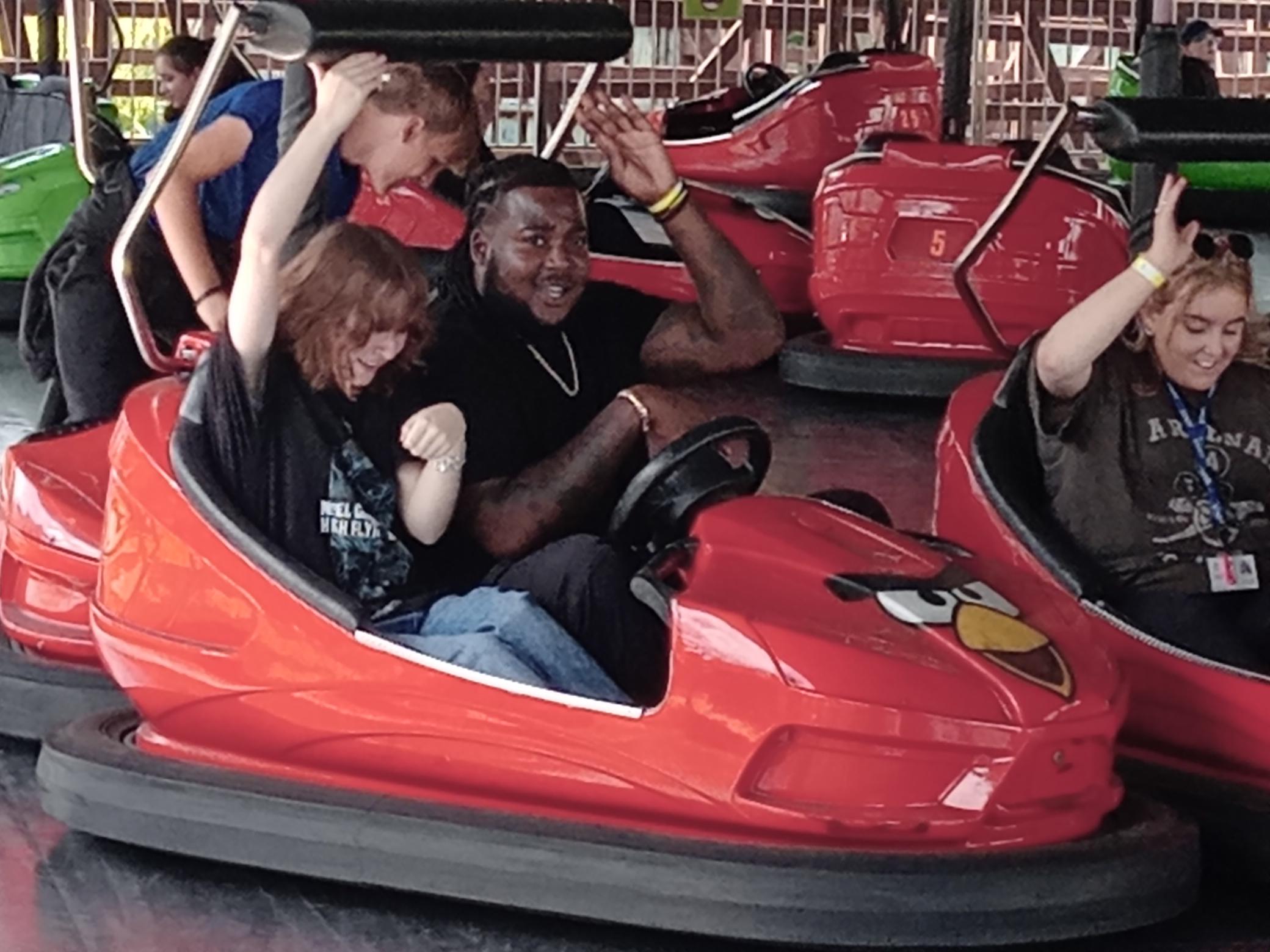 Learners from Break Through SEN school in Belvedere Kent enjoy the dodgems on a school trip